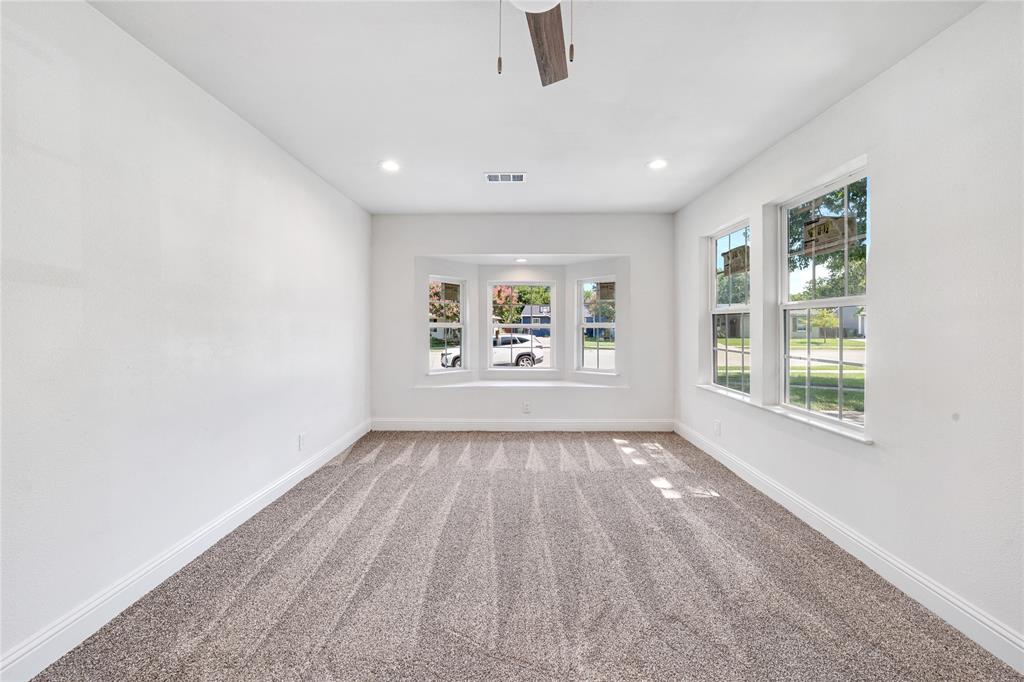 1608 Wynn Terrace Arlington, TX 76010 - Photo 13 of 28 wooden floor in an empty room with a window