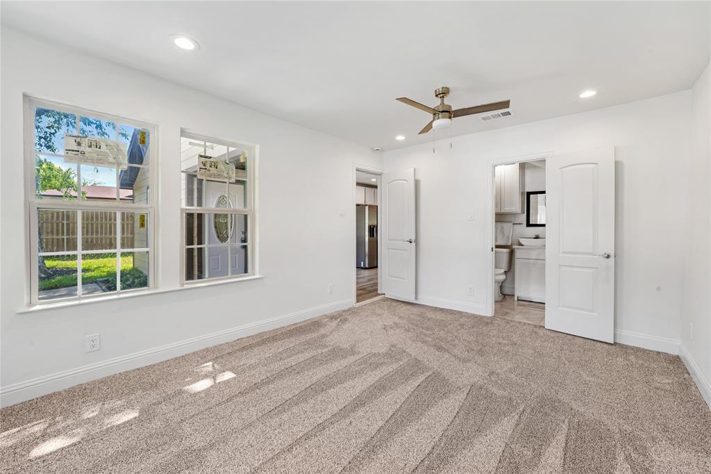 1608 Wynn Terrace Arlington, TX 76010 - Photo 14 of 28 a view of an empty room with a window and kitchen view