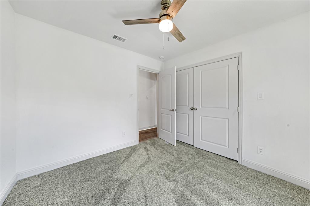 1608 Wynn Terrace Arlington, TX 76010 - Photo 18 of 28 an empty room with a ceiling fan and a window