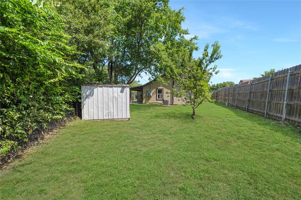 1608 Wynn Terrace Arlington, TX 76010 - Photo 27 of 28 a view of a yard with a tree