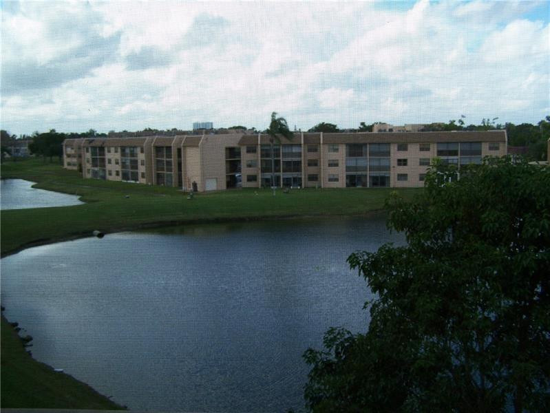 2981 North Nob Hill Road, Unit 406 Sunrise, FL 33322 - Photo 13 of 24 a view of a green field with sky view