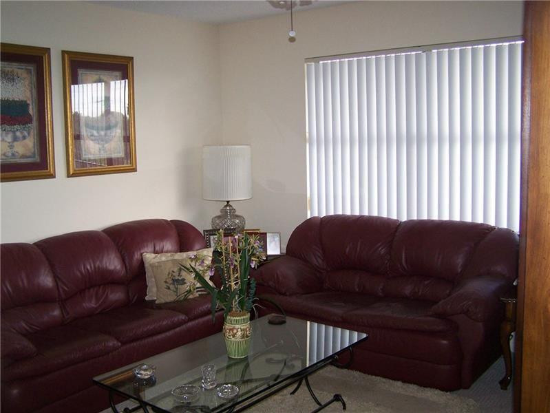 2981 North Nob Hill Road, Unit 406 Sunrise, FL 33322 - Photo 17 of 24 a living room with furniture lamp and a window