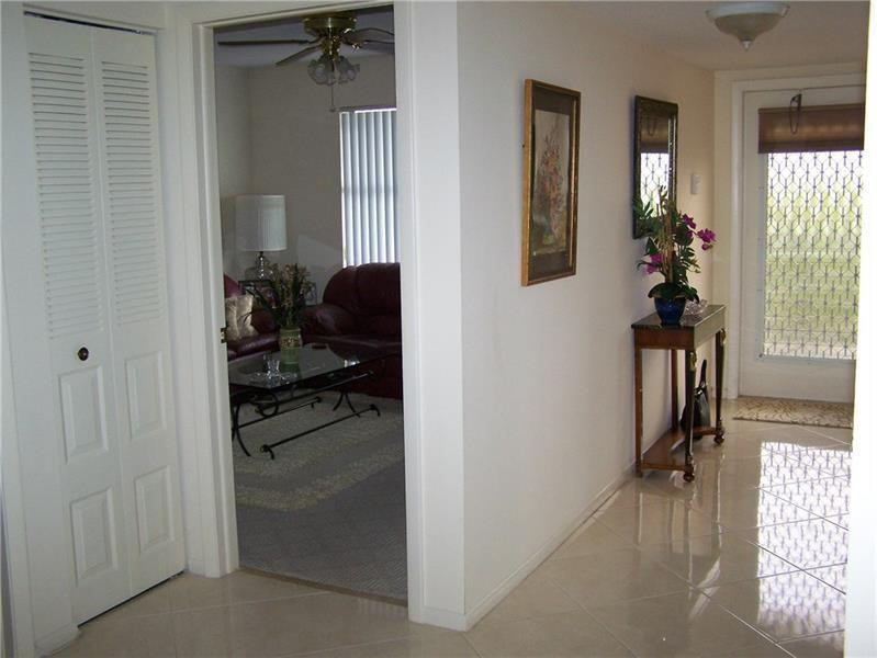 2981 North Nob Hill Road, Unit 406 Sunrise, FL 33322 - Photo 21 of 24 a view of a livingroom from a hallway