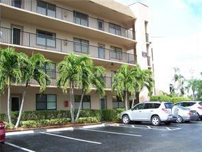 2981 North Nob Hill Road, Unit 406 Sunrise, FL 33322 - Photo 24 of 24 a view of street with parked cars