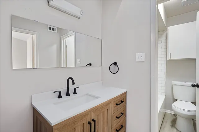 a bathroom with a sink and a toilet