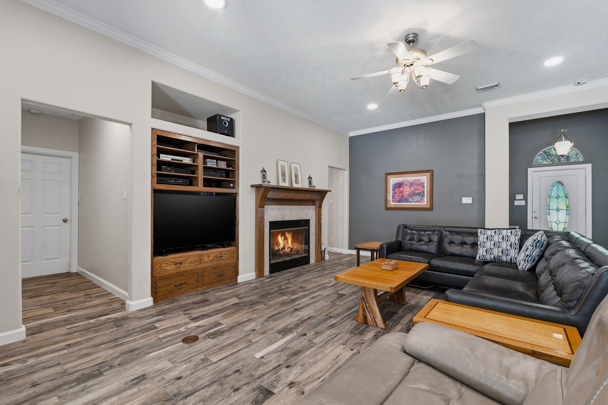11714 Creek View Lane Conroe, TX 77385 - Photo 11 of 46 a living room with furniture and a fireplace