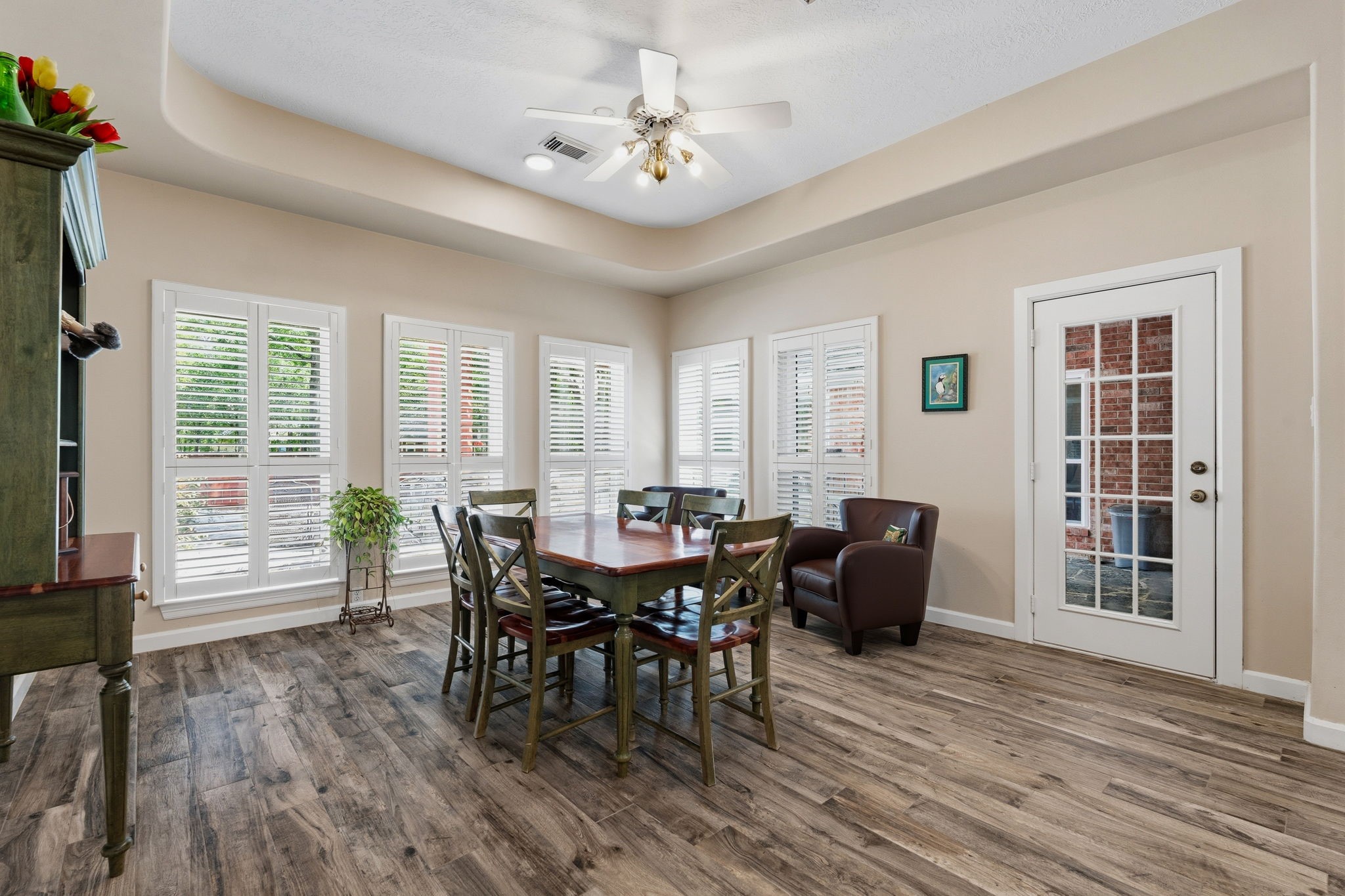 11714 Creek View Lane Conroe, TX 77385 - Photo 16 of 46 a view of a dining room with furniture and wooden floor