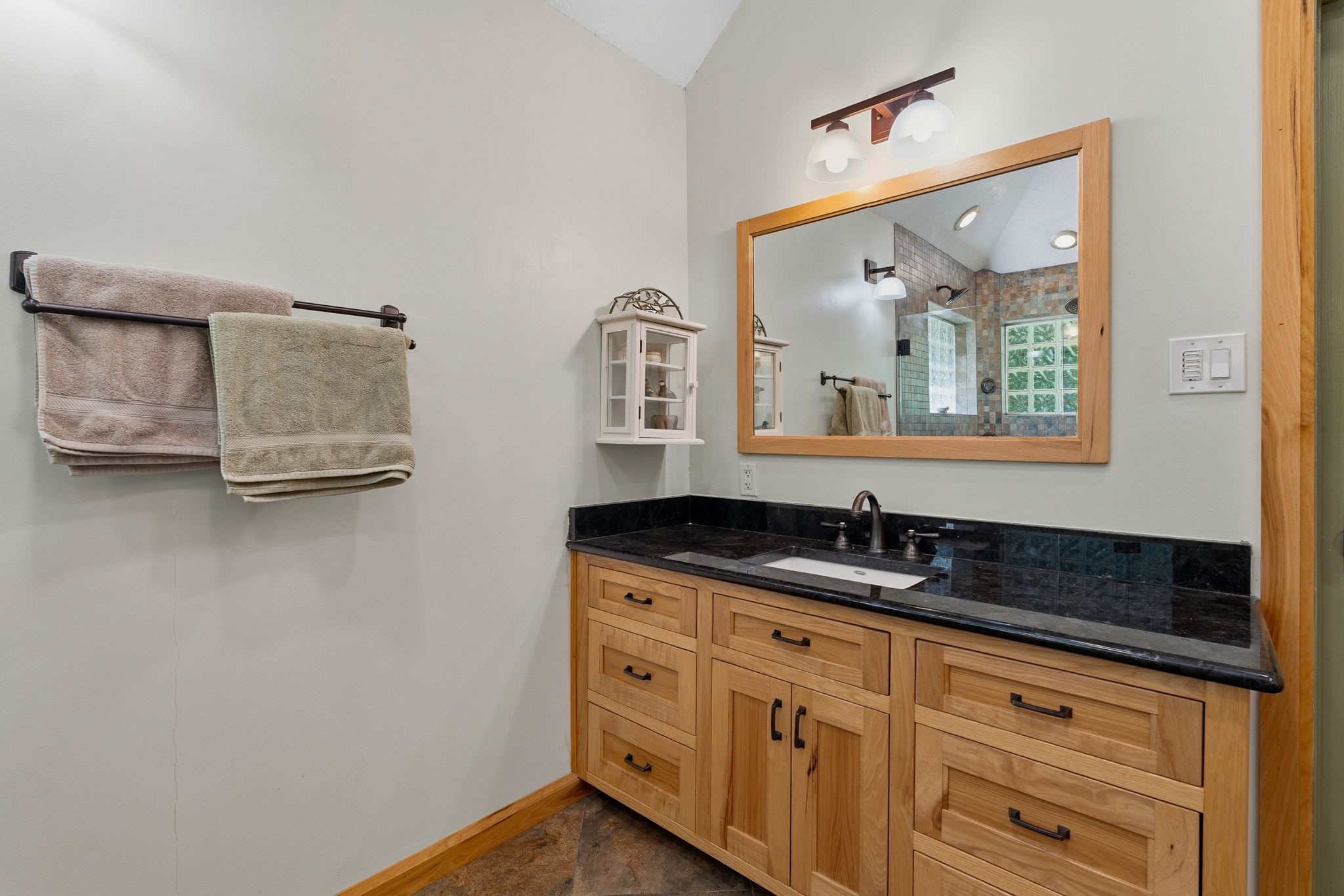 11714 Creek View Lane Conroe, TX 77385 - Photo 21 of 46 a bathroom with a granite countertop sink and a mirror