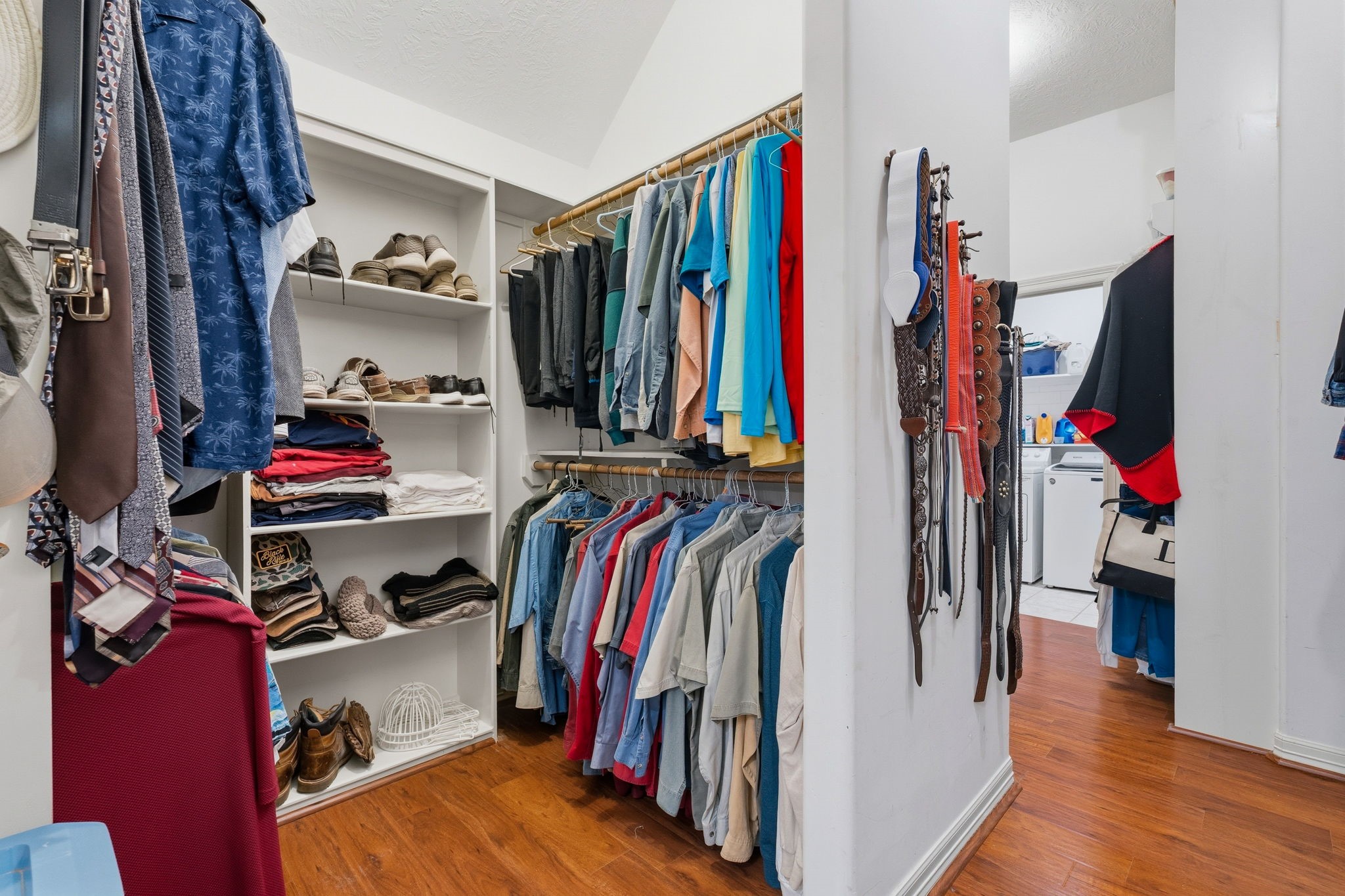 11714 Creek View Lane Conroe, TX 77385 - Photo 23 of 46 a view of walk in closet with clothes and shoes