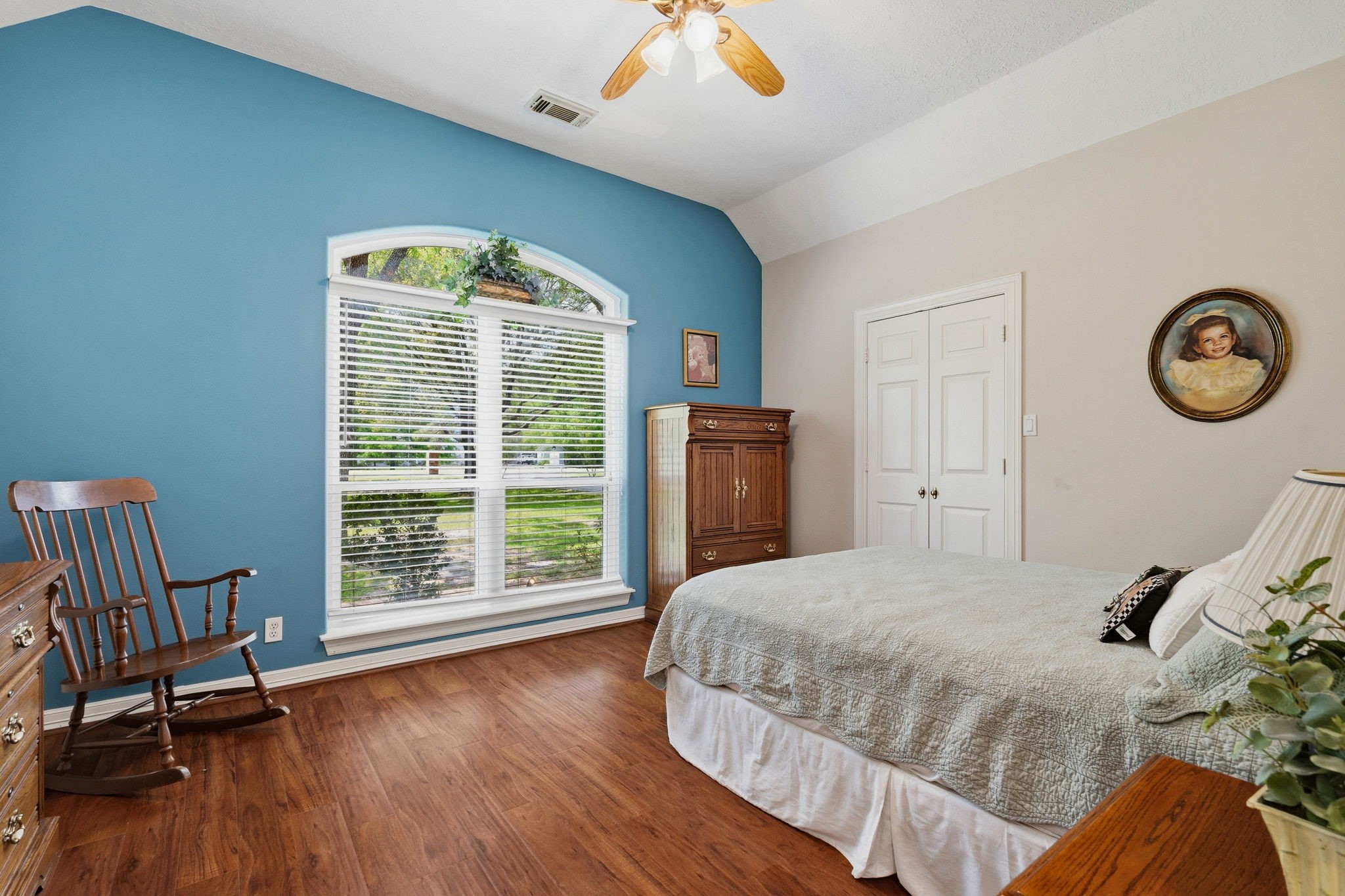 11714 Creek View Lane Conroe, TX 77385 - Photo 24 of 46 a bedroom with a bed and a large window