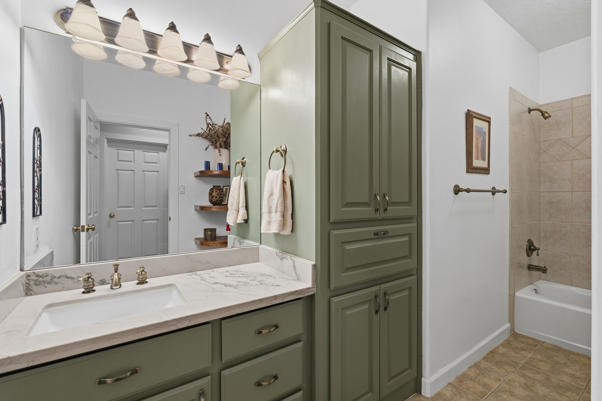 11714 Creek View Lane Conroe, TX 77385 - Photo 28 of 46 a bathroom with a granite countertop sink tub shower and a mirror
