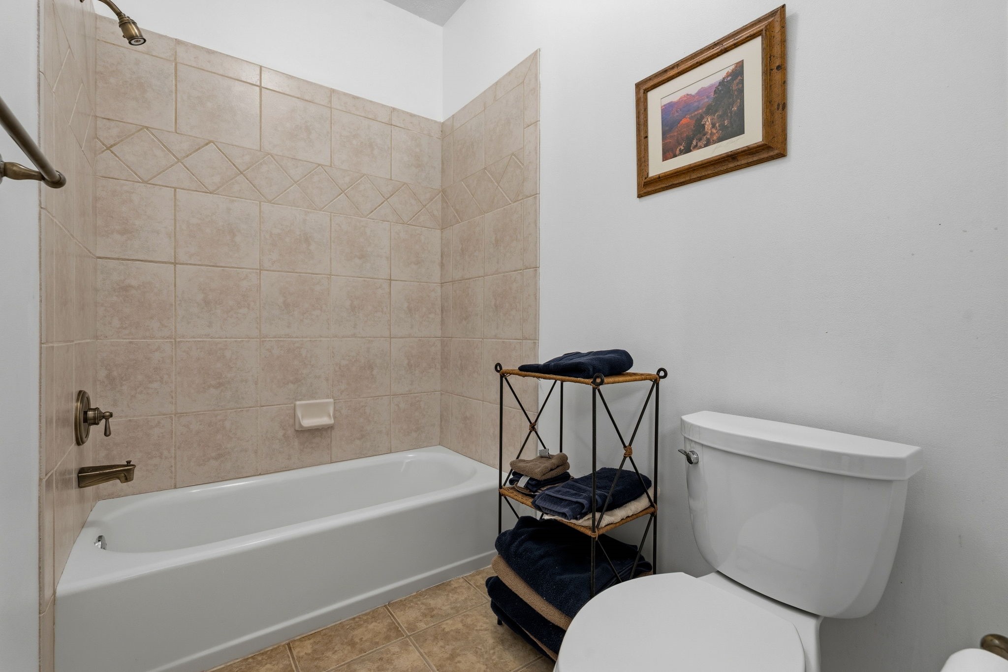 11714 Creek View Lane Conroe, TX 77385 - Photo 29 of 46 a white toilet sitting next to a bath tub