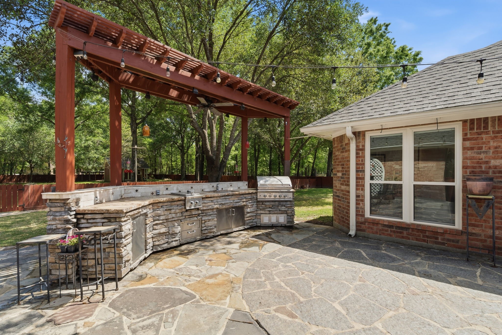 11714 Creek View Lane Conroe, TX 77385 - Photo 33 of 46 a view of a patio with table and chairs with wooden floor and fence