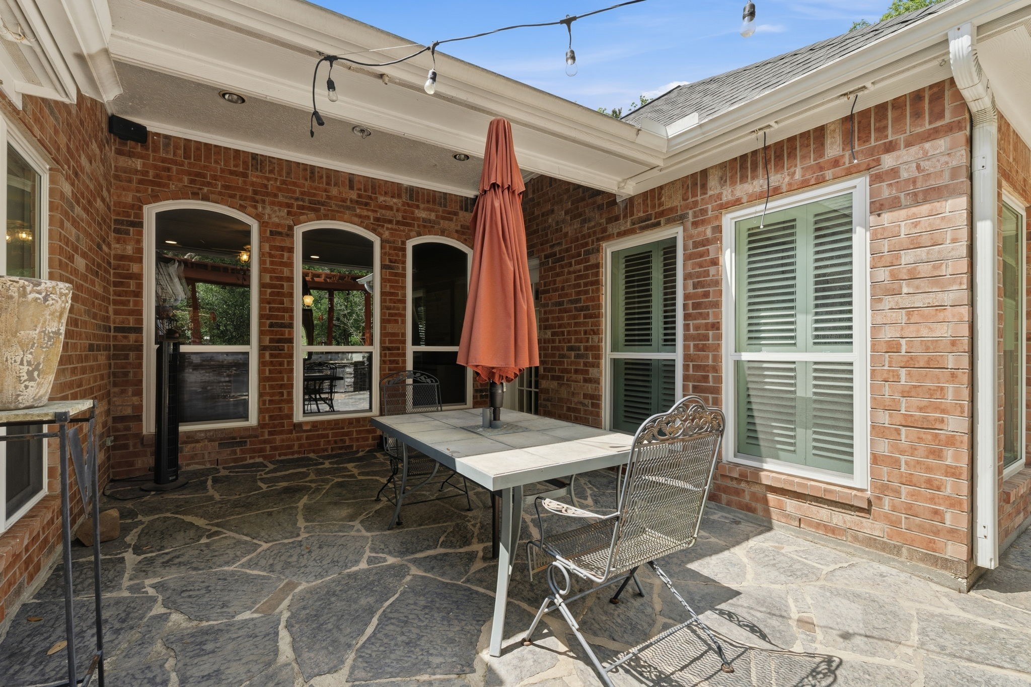 11714 Creek View Lane Conroe, TX 77385 - Photo 34 of 46 a view of a dinning table and chairs in the patio