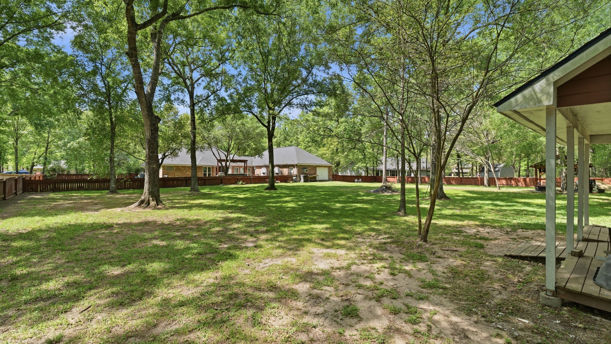 11714 Creek View Lane Conroe, TX 77385 - Photo 37 of 46 a view of a house with a backyard