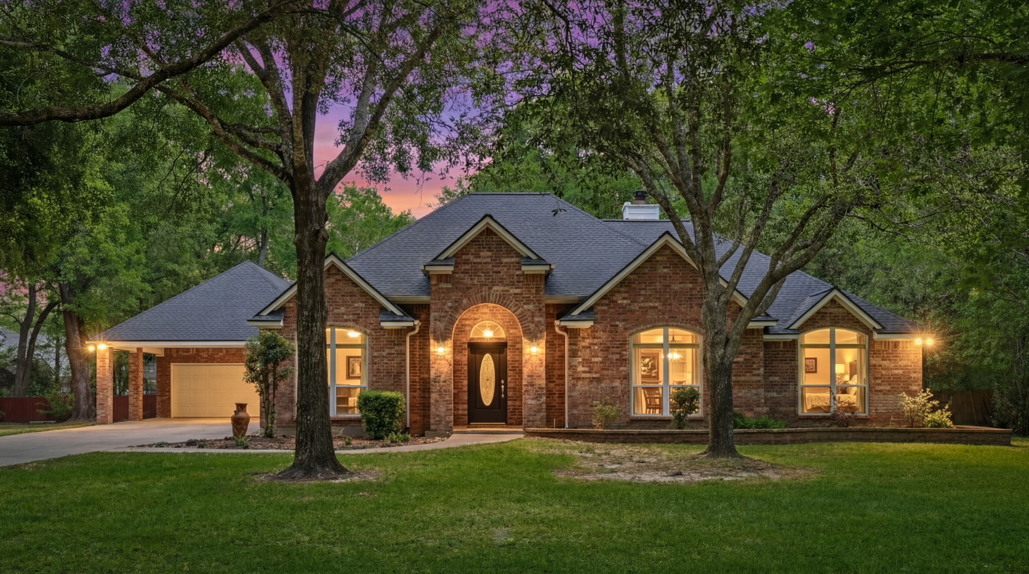 11714 Creek View Lane Conroe, TX 77385 - Photo 42 of 46 a front view of a house with a yard