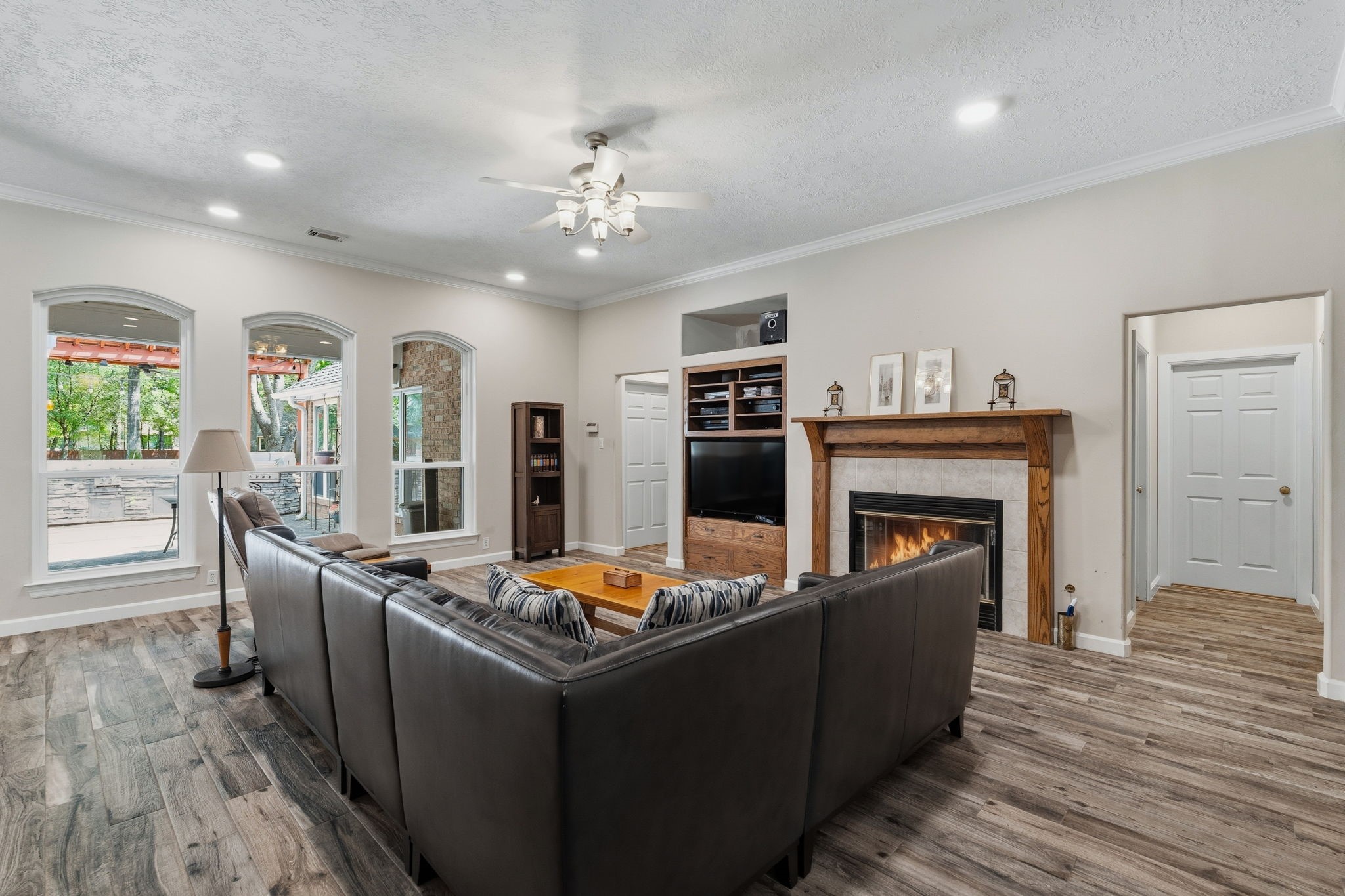 11714 Creek View Lane Conroe, TX 77385 - Photo 8 of 46 a living room with furniture and a fireplace