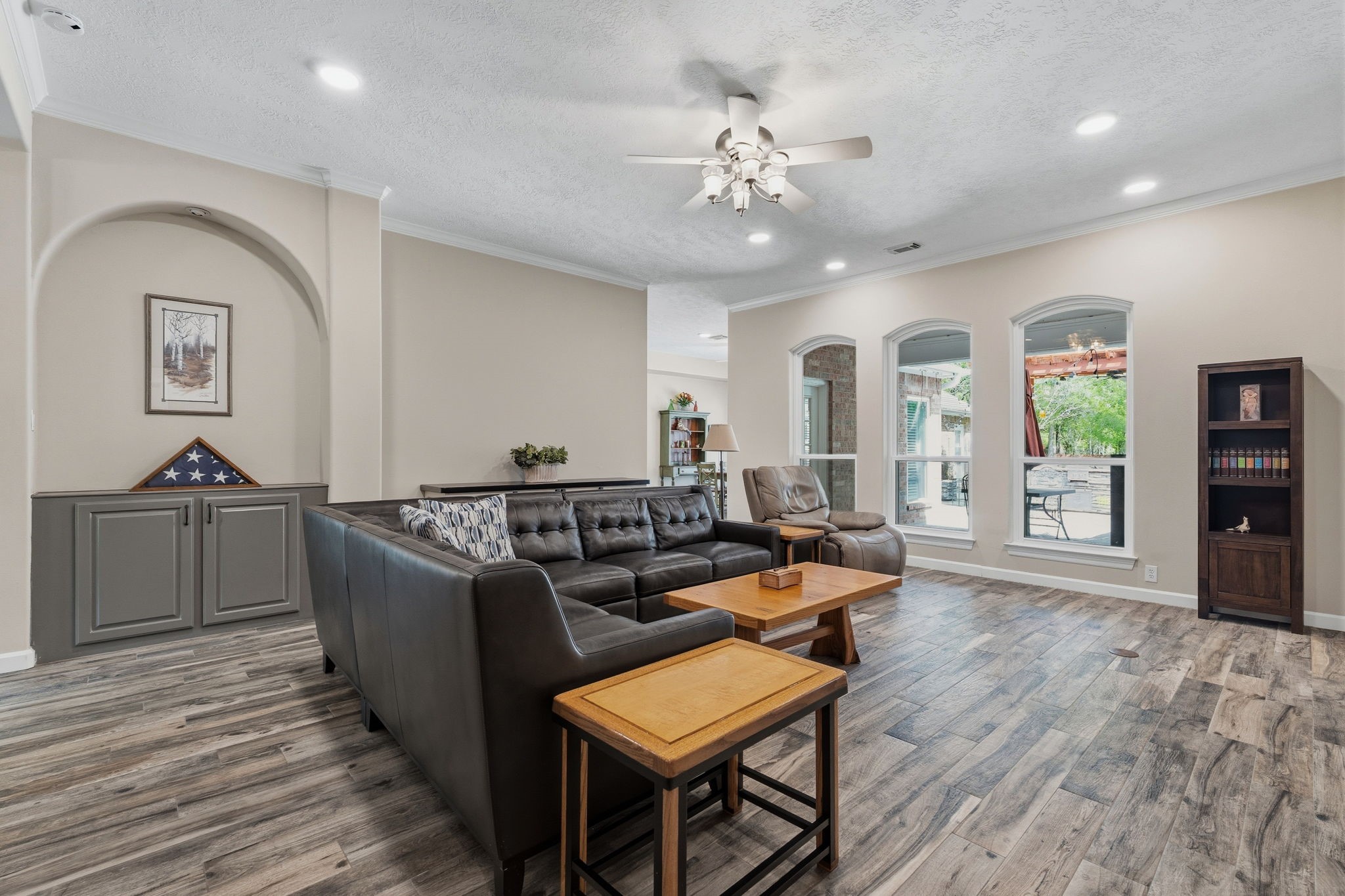 11714 Creek View Lane Conroe, TX 77385 - Photo 9 of 46 a living room with furniture and a chandelier