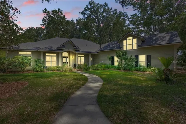 a view of a balcony with furniture and front door