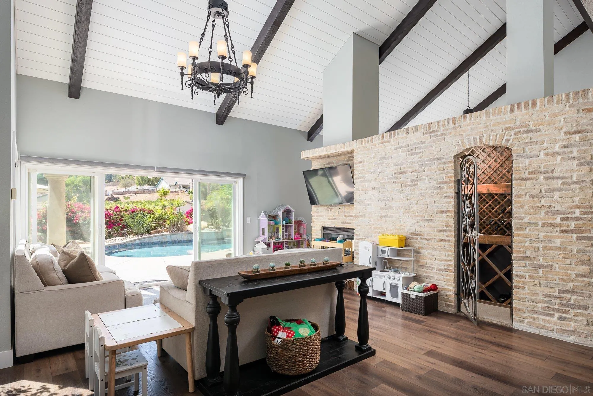 14298 Ipava Drive Poway, CA 92064 - Photo 17 of 74 a living room with fireplace furniture and a flat screen tv