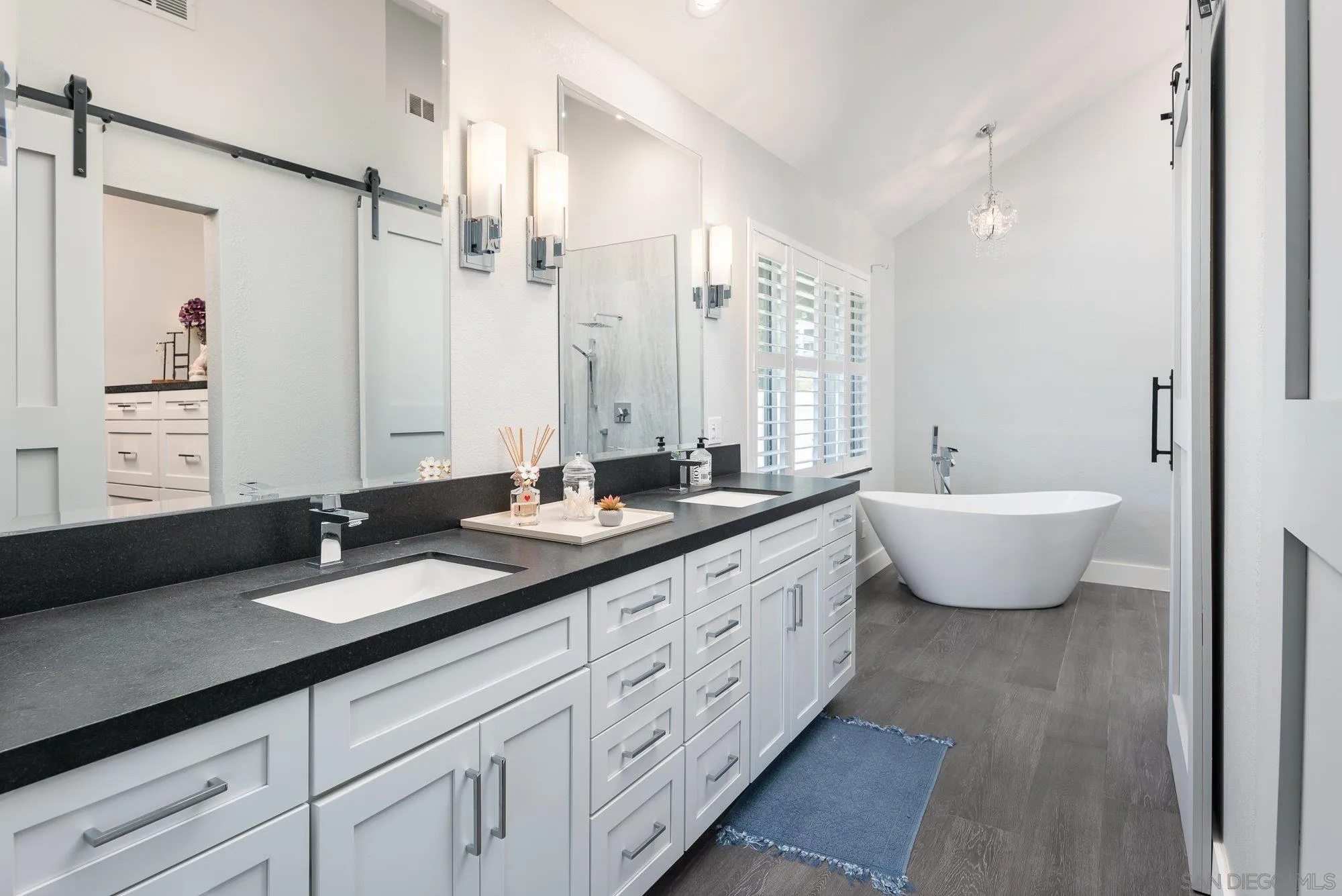 14298 Ipava Drive Poway, CA 92064 - Photo 22 of 74 a bathroom with a double vanity sink double mirror and bathtub