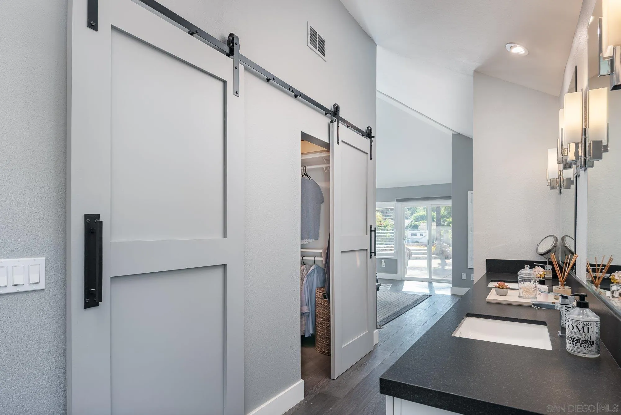 14298 Ipava Drive Poway, CA 92064 - Photo 24 of 74 a view of a hallway with bathroom and glass door