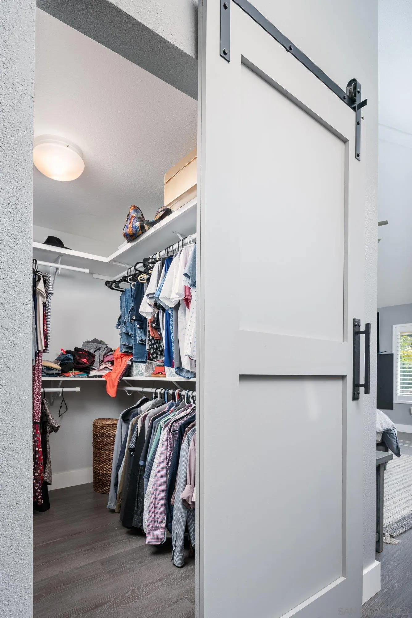 14298 Ipava Drive Poway, CA 92064 - Photo 25 of 74 a view of walk in closet with clothes and shoes