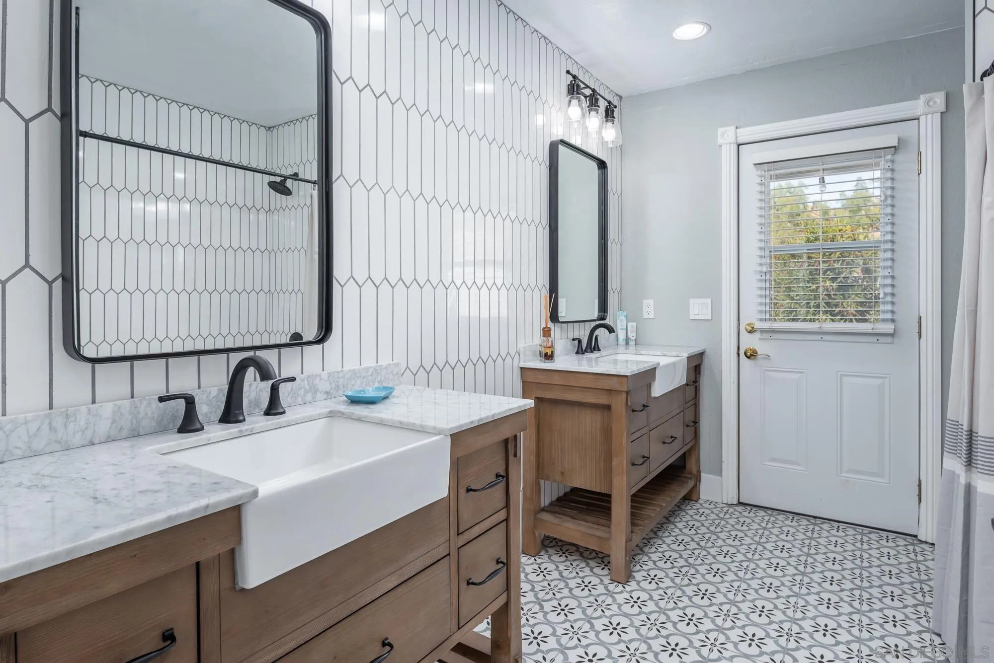 14298 Ipava Drive Poway, CA 92064 - Photo 30 of 74 a bathroom with a sink double vanity and a mirror