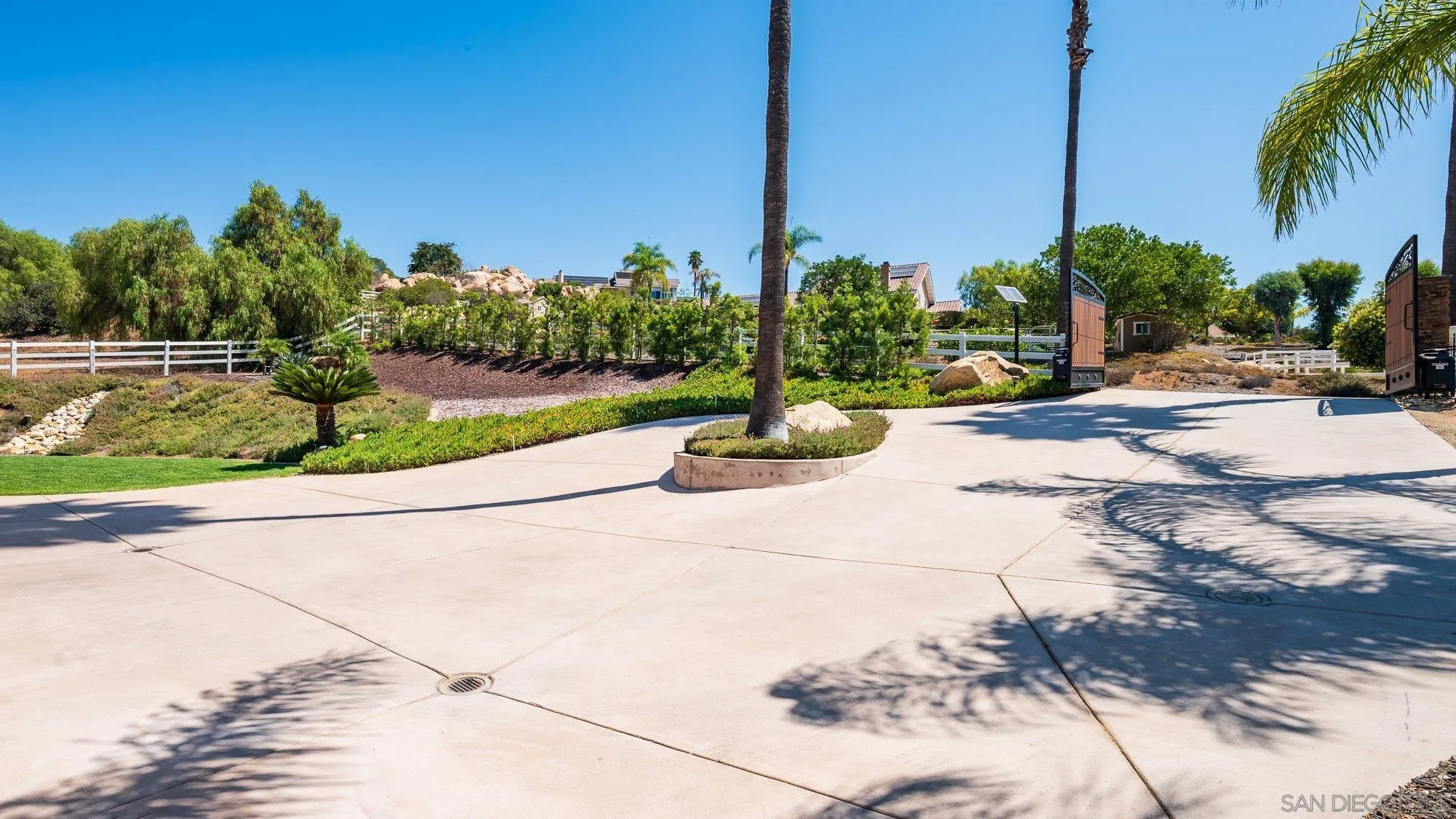 14298 Ipava Drive Poway, CA 92064 - Photo 3 of 74 a view of a yard with palm tree