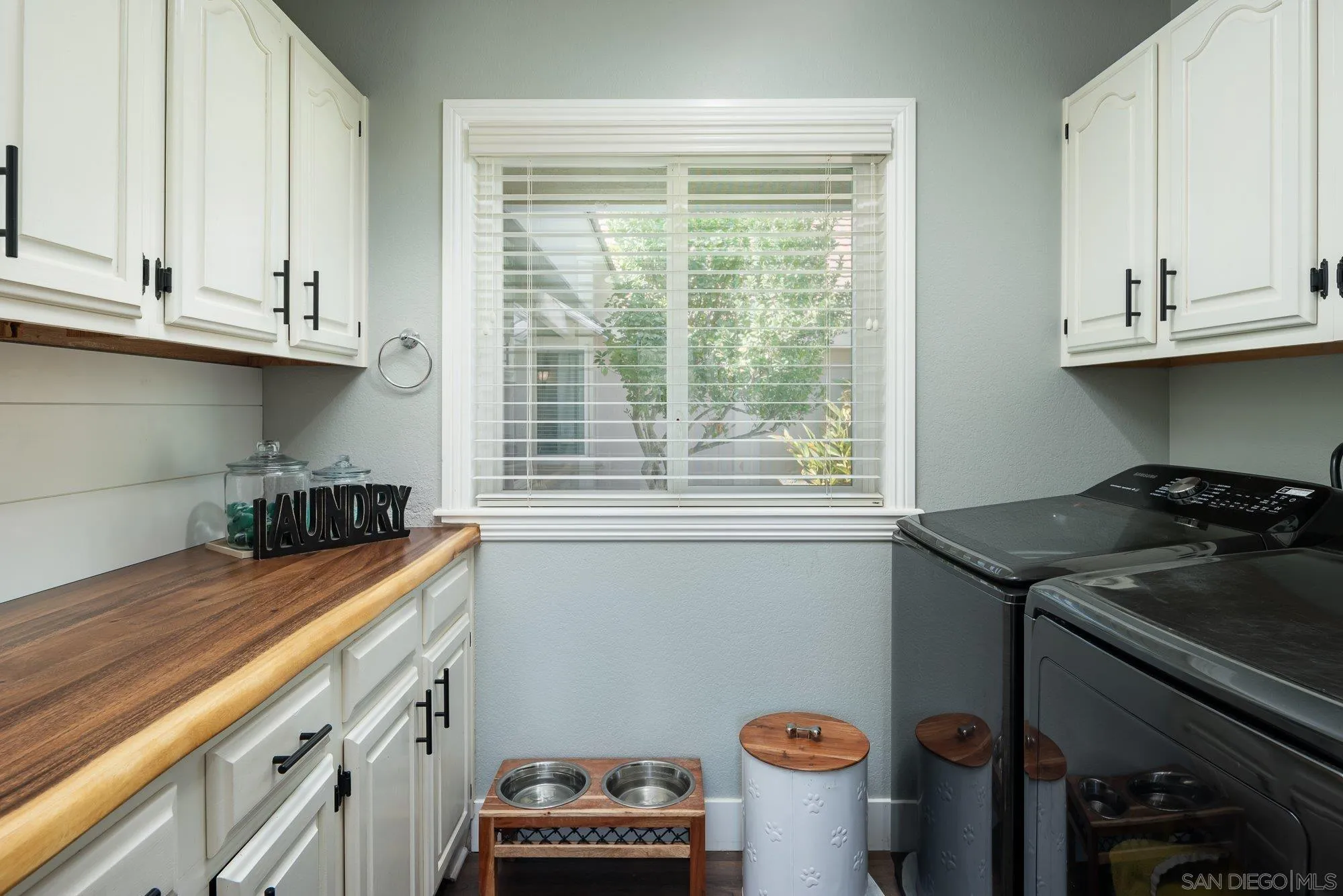 14298 Ipava Drive Poway, CA 92064 - Photo 32 of 74 a kitchen with stainless steel appliances a sink a stove and a window