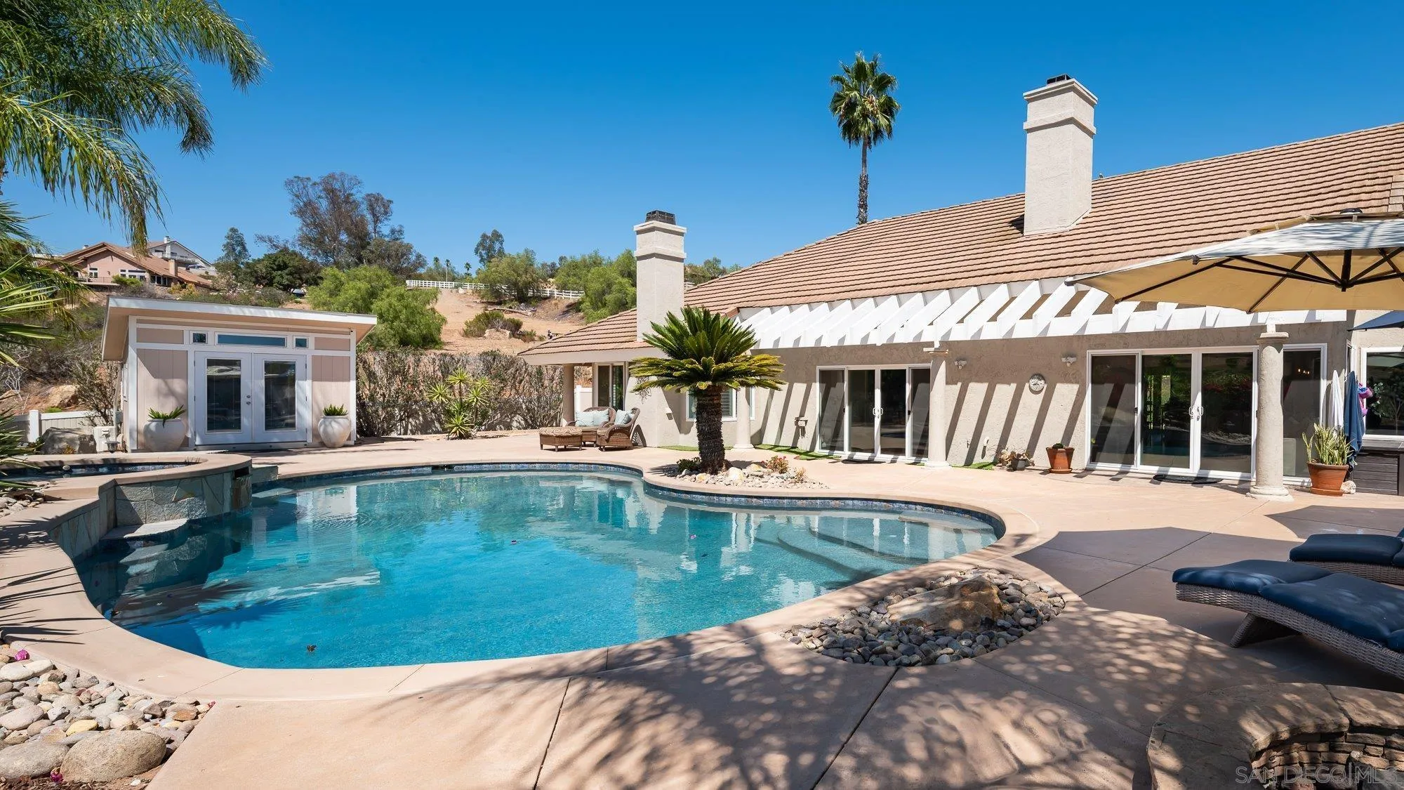 14298 Ipava Drive Poway, CA 92064 - Photo 33 of 74 a view of a house with swimming pool and sitting area