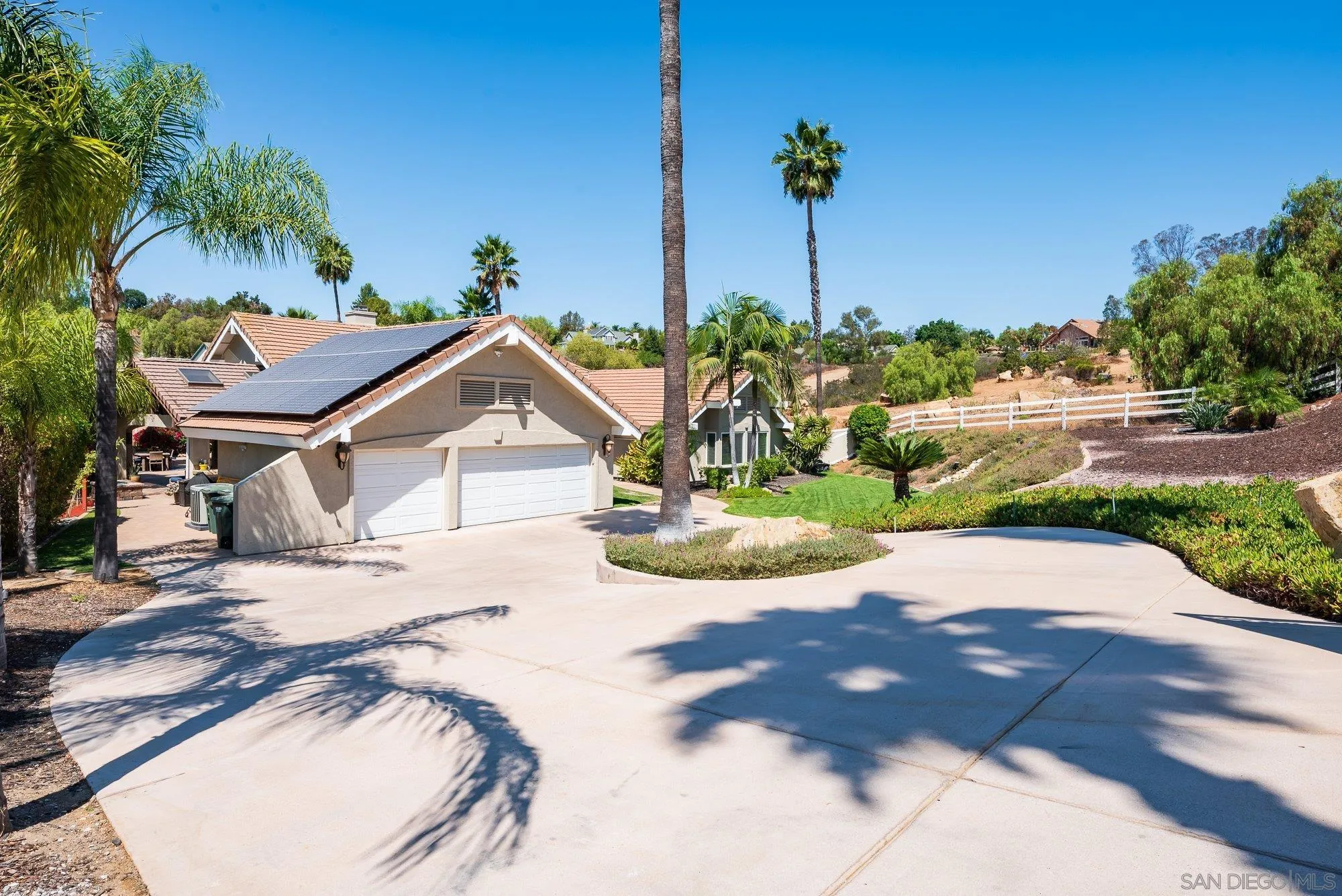 14298 Ipava Drive Poway, CA 92064 - Photo 5 of 74 a view of a house with a yard and potted plants
