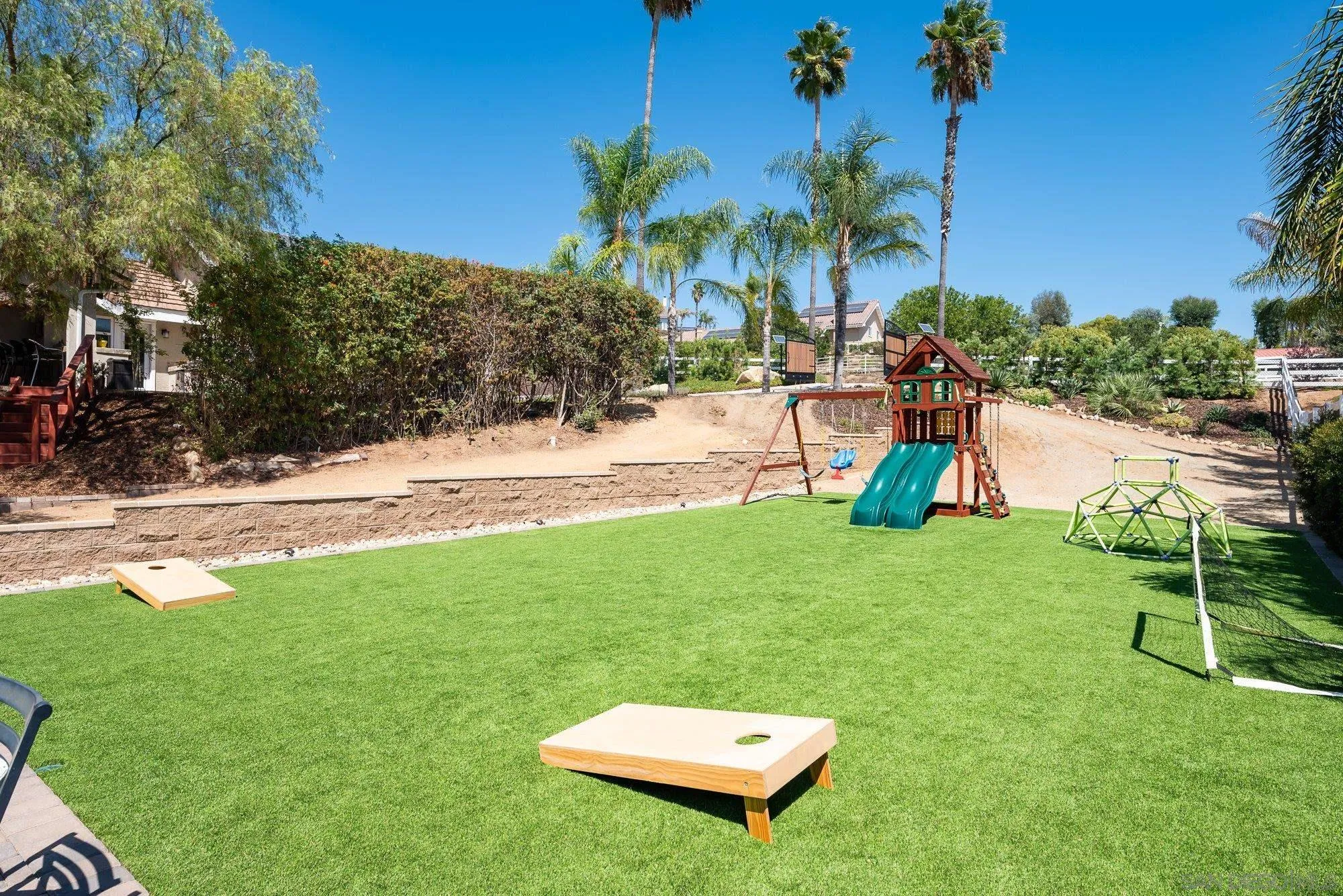 14298 Ipava Drive Poway, CA 92064 - Photo 62 of 74 a view of a backyard with a slide