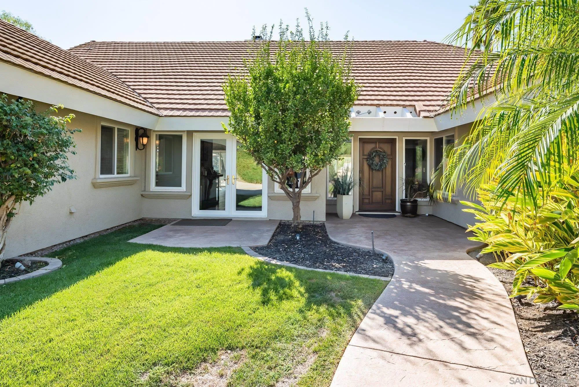 14298 Ipava Drive Poway, CA 92064 - Photo 7 of 74 a front view of a house with garden
