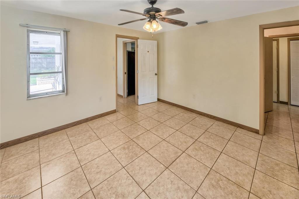 29 Caribbean Road Naples, FL 34108 - Photo 20 of 32 Tiled spare room with ceiling fan