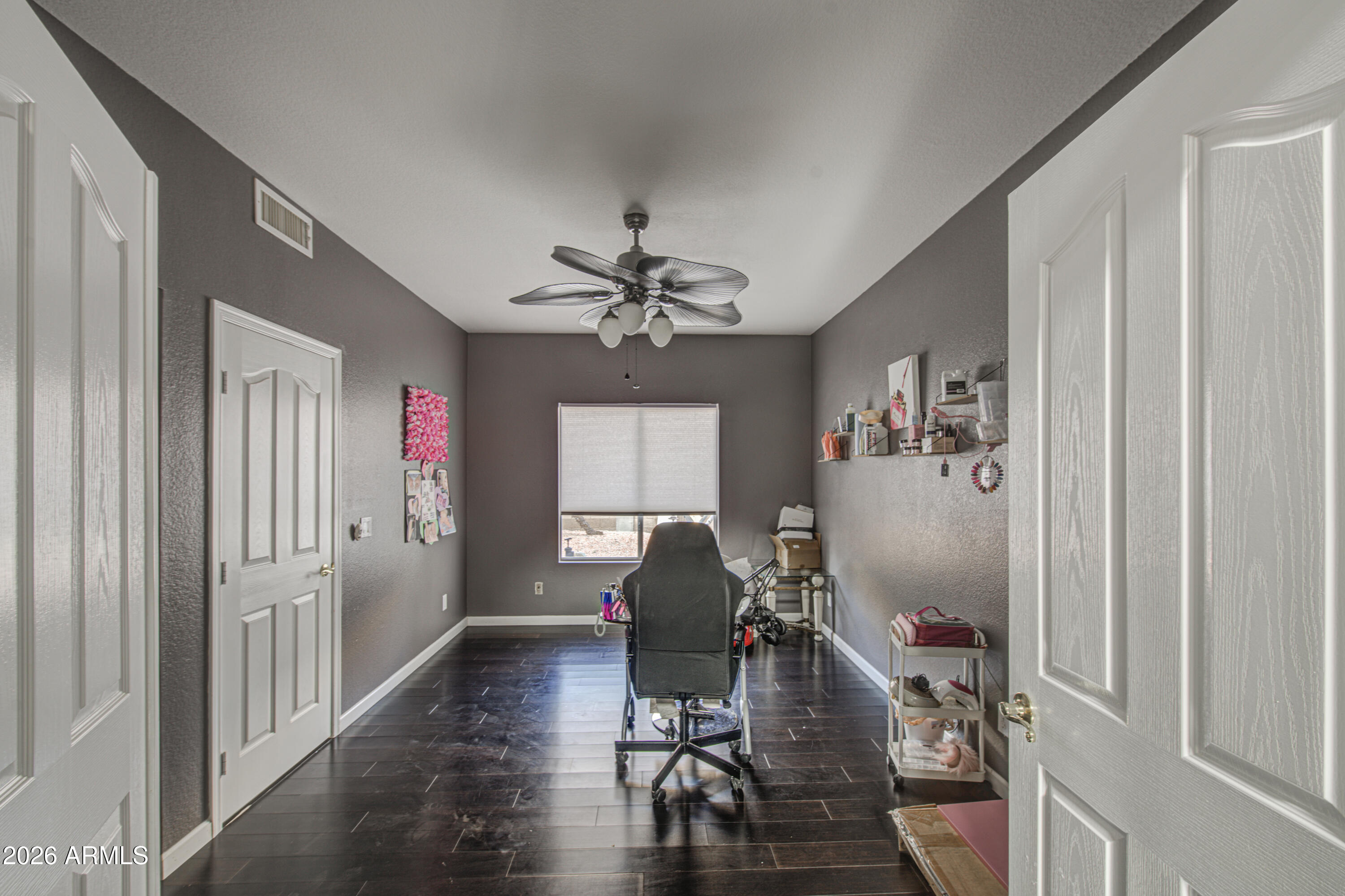 12403 West Monte Vista Road Avondale, AZ 85392 - Photo 42 of 63 a workspace with wooden floor and windows