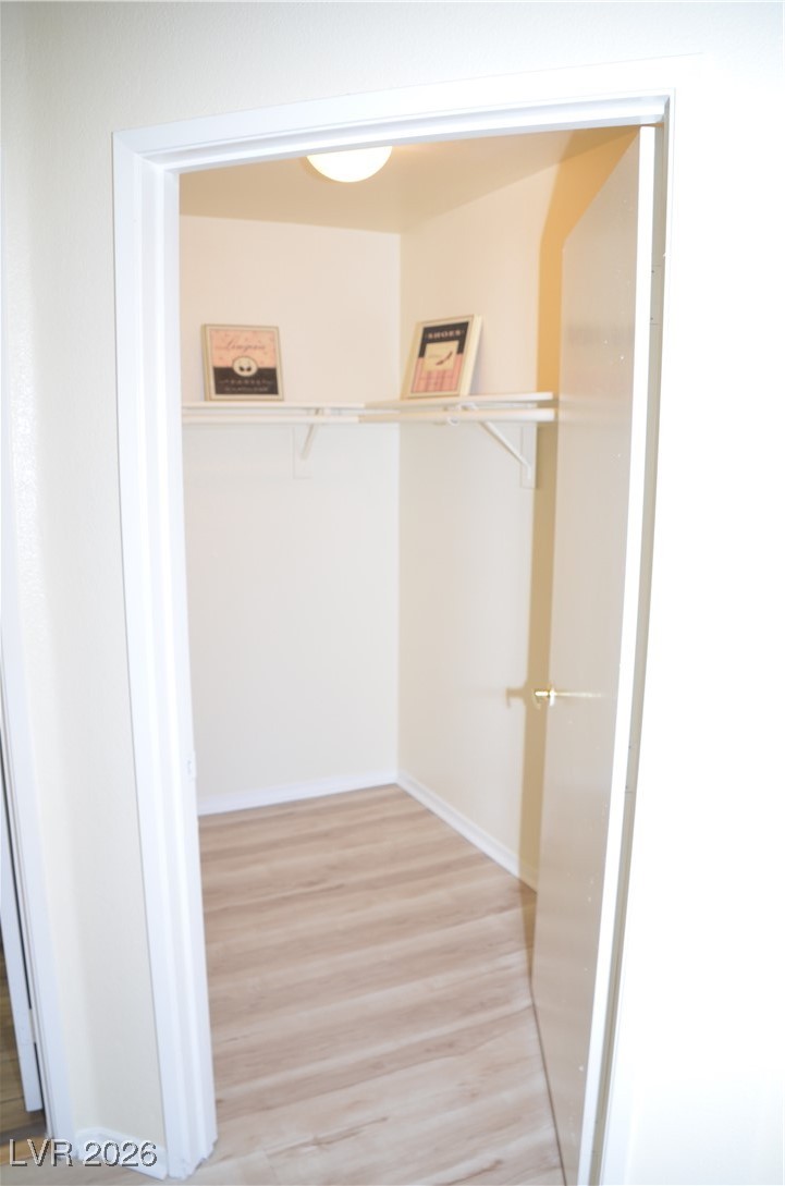 1881 West Alexander Road, Unit 2101 North Las Vegas, NV 89032 - Photo 15 of 37 Walk in closet with light wood finished floors