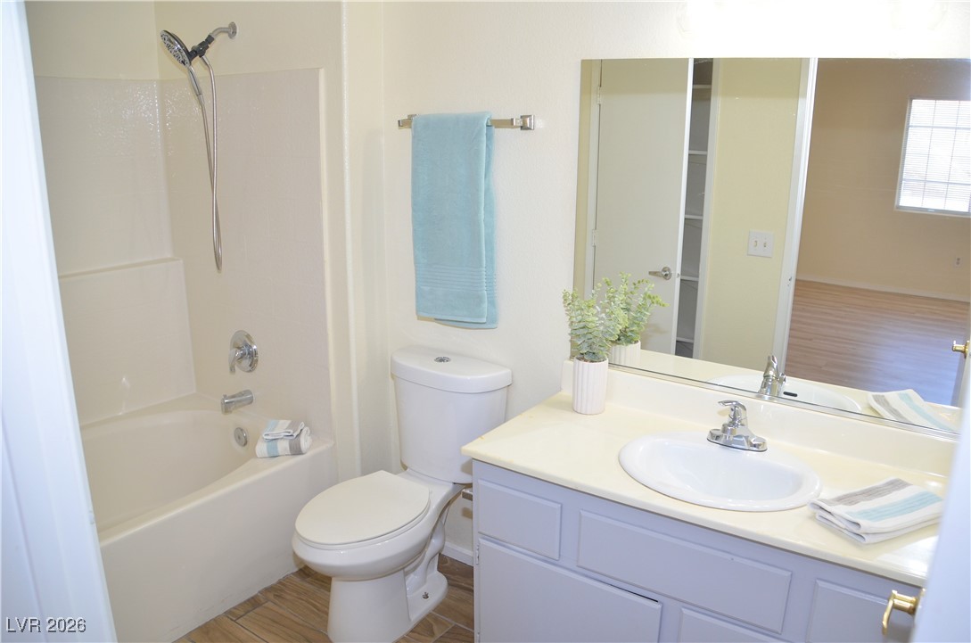 1881 West Alexander Road, Unit 2101 North Las Vegas, NV 89032 - Photo 17 of 37 Full bathroom with tub / shower combination, wood finished floors, and vanity