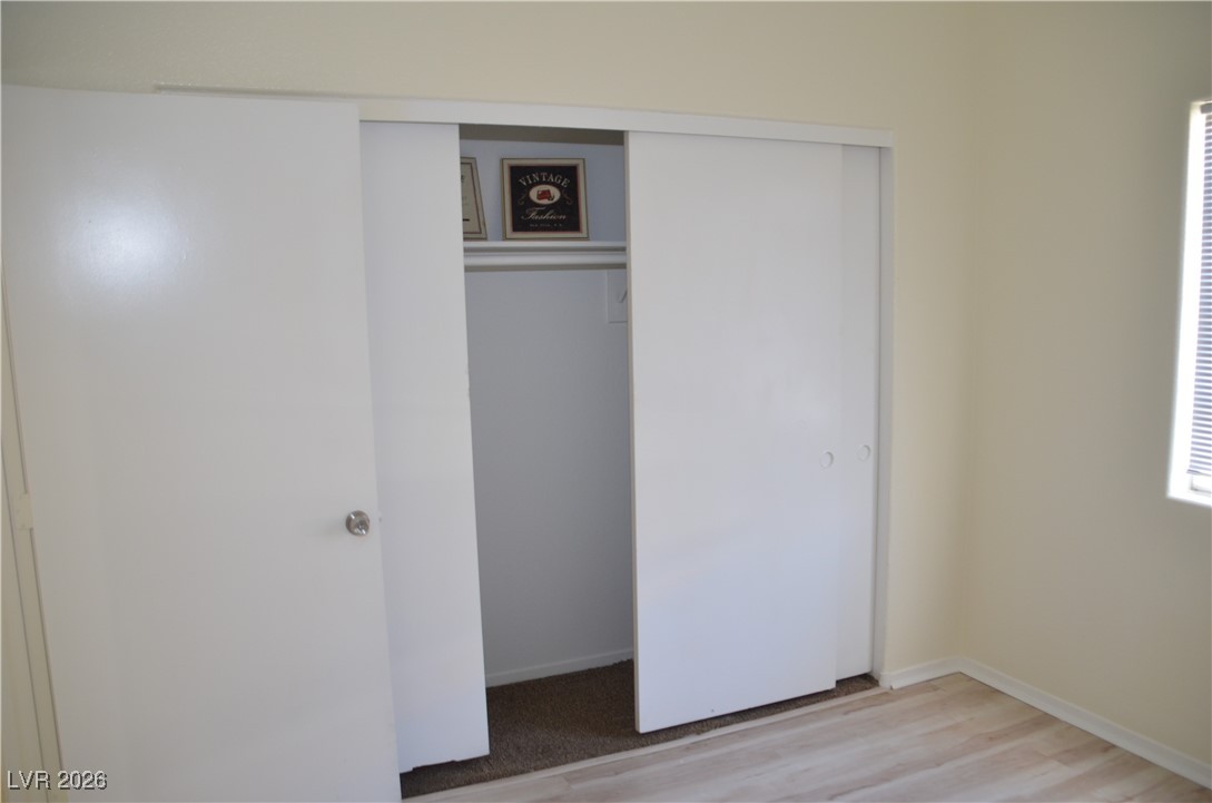 1881 West Alexander Road, Unit 2101 North Las Vegas, NV 89032 - Photo 19 of 37 Unfurnished bedroom with a closet and light wood finished floors