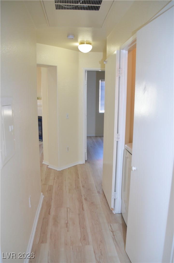 1881 West Alexander Road, Unit 2101 North Las Vegas, NV 89032 - Photo 22 of 37 Corridor featuring light wood-style floors