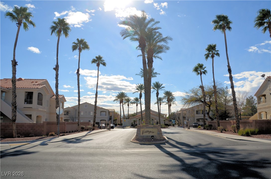 1881 West Alexander Road, Unit 2101 North Las Vegas, NV 89032 - Photo 37 of 37 View of asphalt road featuring sidewalks, a residential view, and curbs