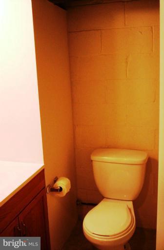 5501 Whitby Road Baltimore, MD 21206 - Photo 16 of 21 a white toilet sitting next to a shower