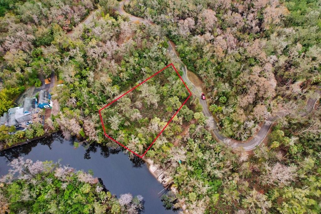 4872 Rambling River Road Brandon, FL 33511 - Photo 19 of 29 an aerial view of a houses with a yard