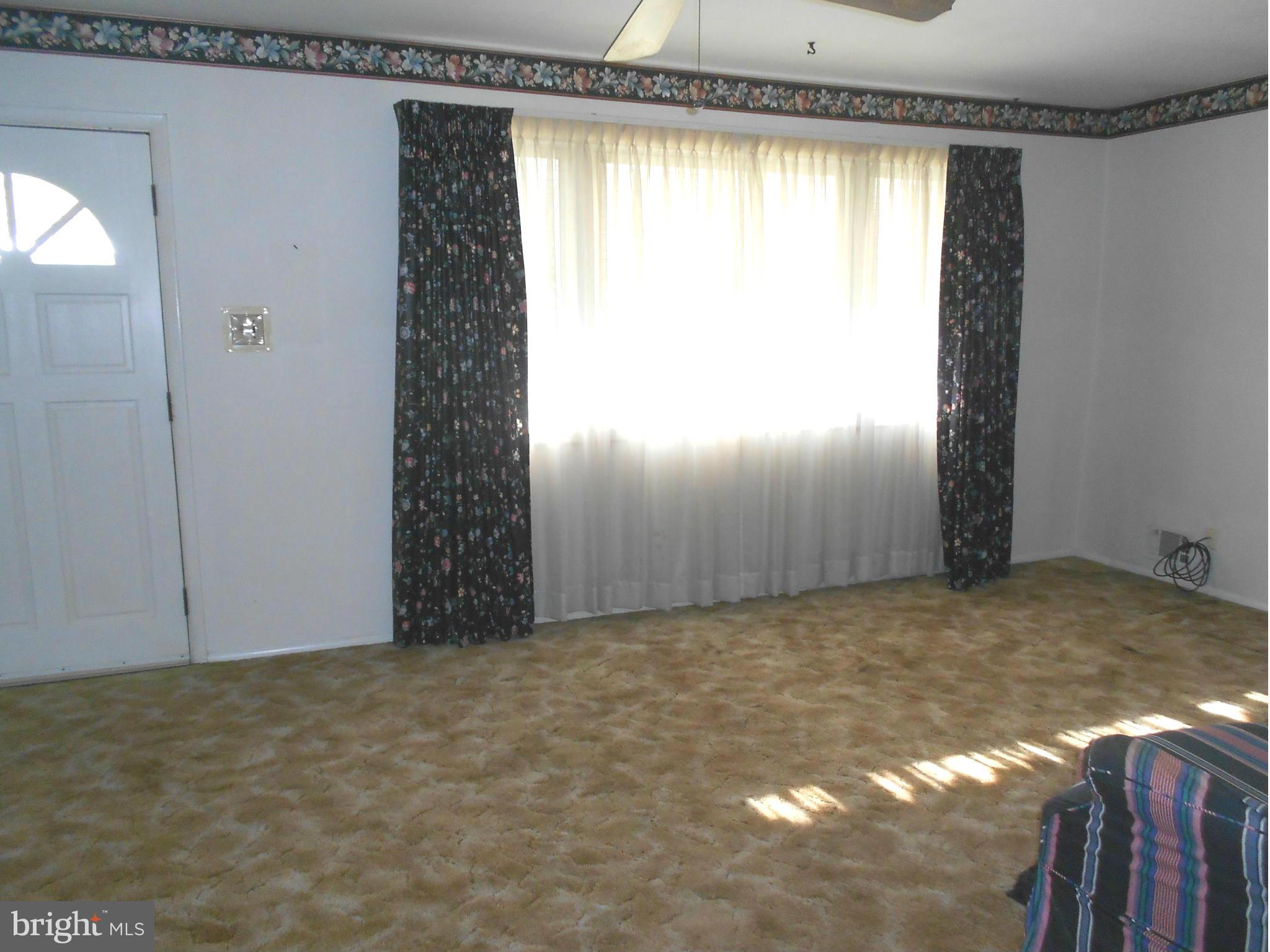 7704 Seekford Road Baltimore, MD 21219 - Photo 2 of 23 Hardwood under carpet