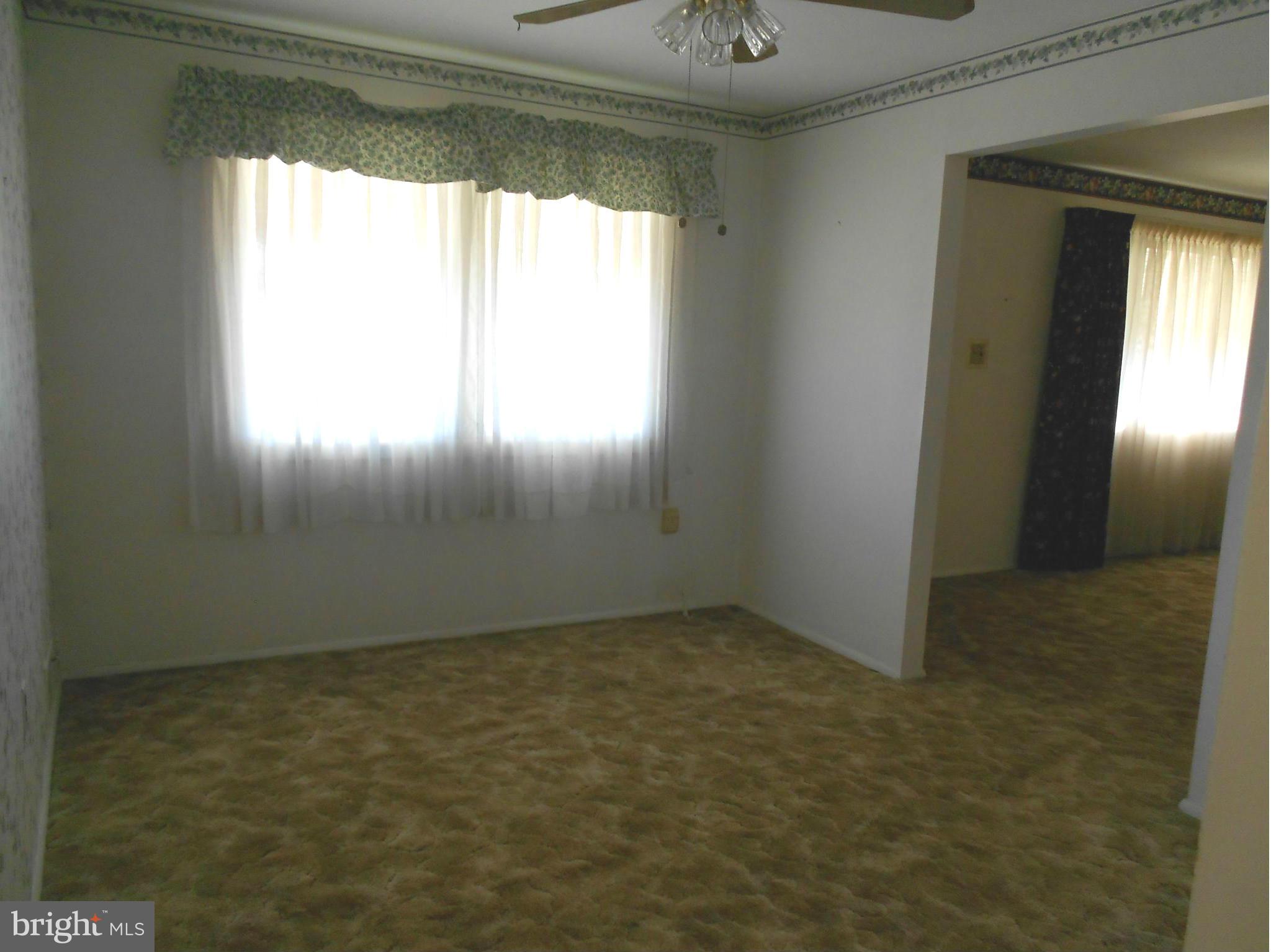 7704 Seekford Road Baltimore, MD 21219 - Photo 3 of 23 Hardwood under carpet