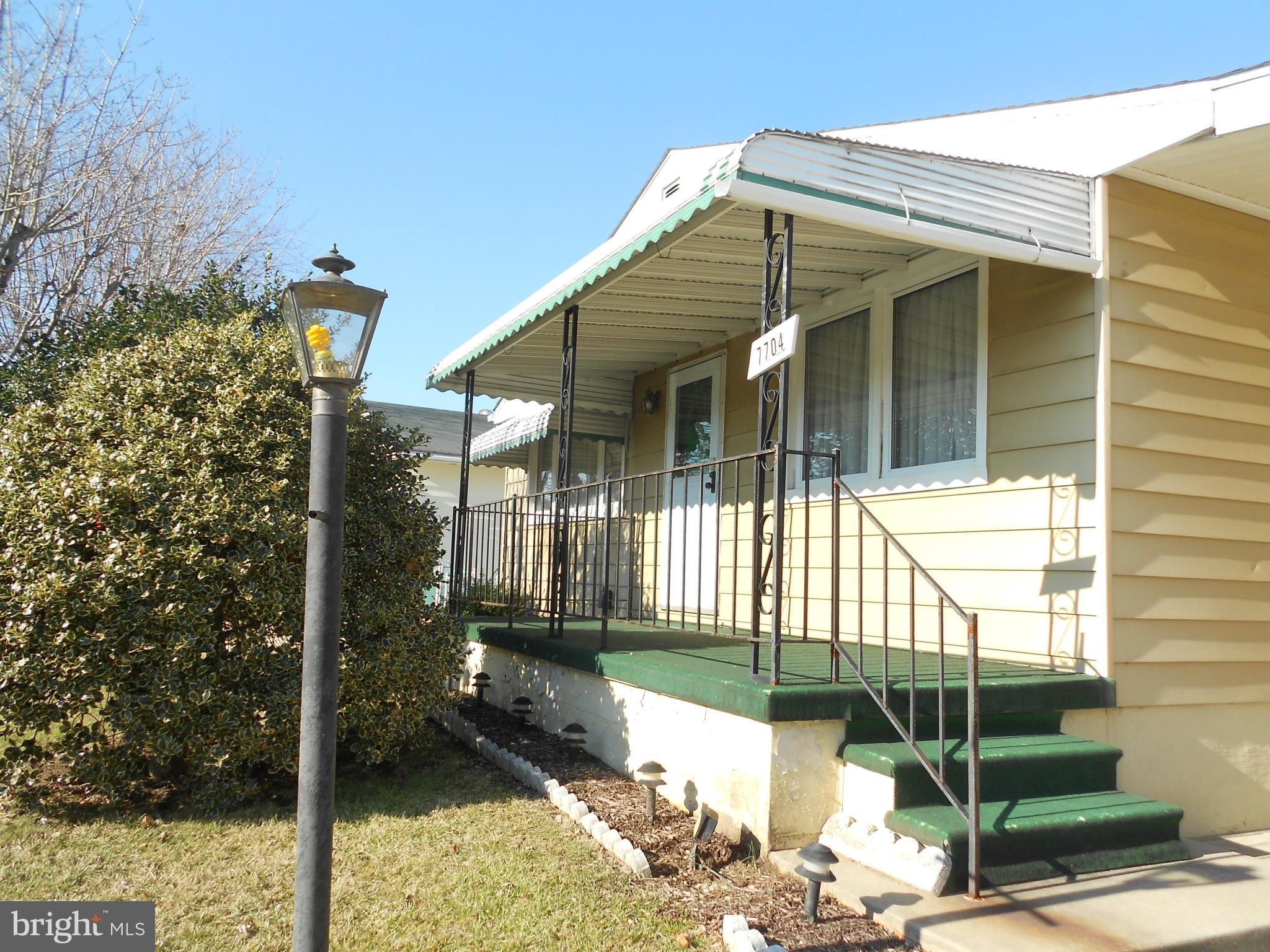 7704 Seekford Road Baltimore, MD 21219 - Photo 22 of 23 Covered front porch