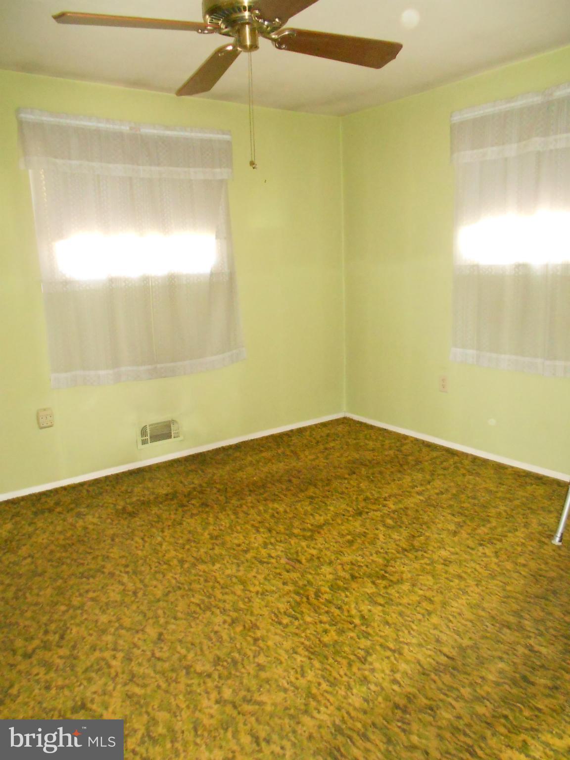 7704 Seekford Road Baltimore, MD 21219 - Photo 8 of 23 Hardwood under carpet