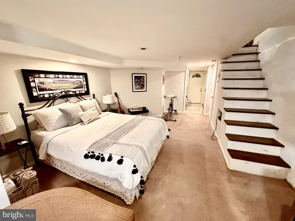 a bed room with a bed and a couch