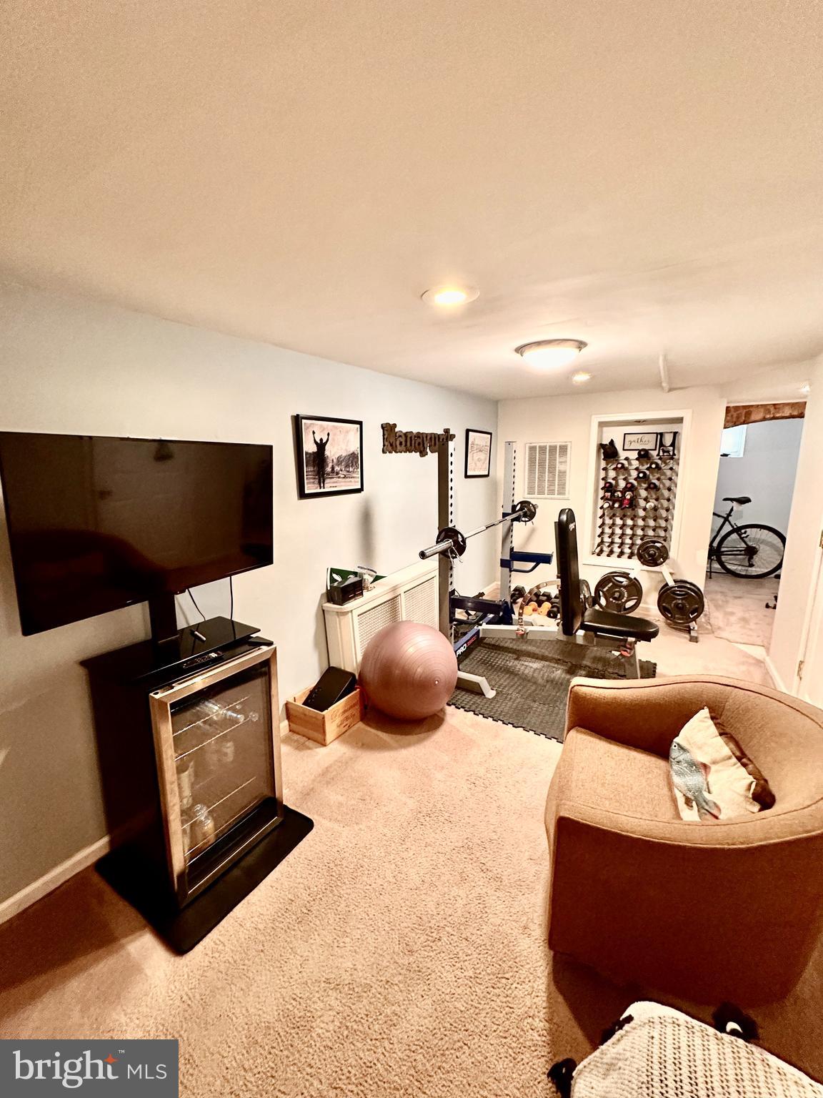4531 Wilde Street Philadelphia, PA 19127 - Photo 13 of 23 a living room with furniture a flat screen tv and a lamp