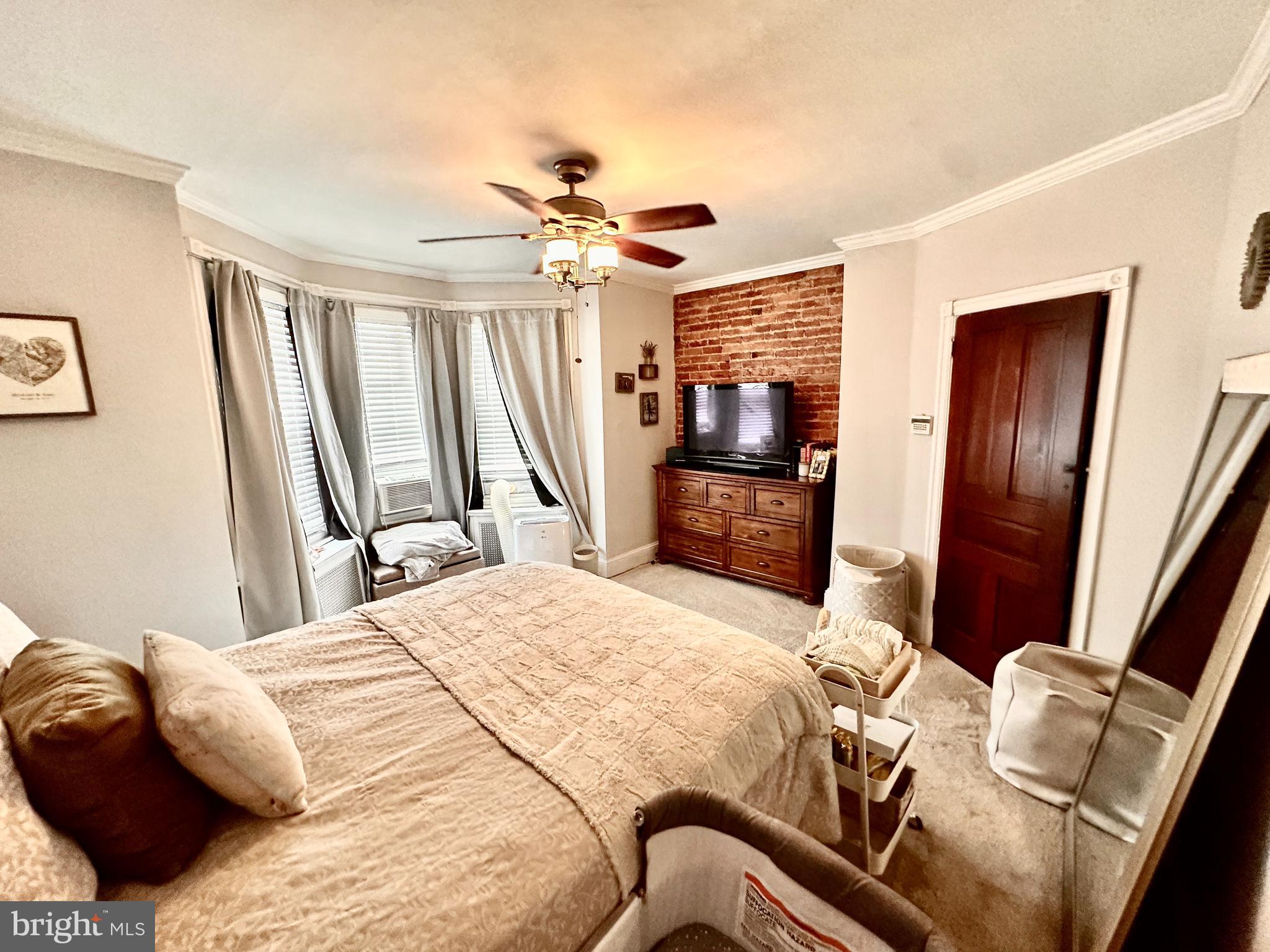 4531 Wilde Street Philadelphia, PA 19127 - Photo 14 of 23 a bedroom with a bed dresser and a flat tv screen